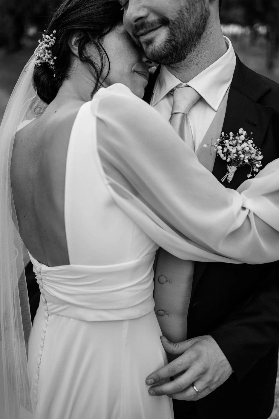 The couple embracing, in black and white