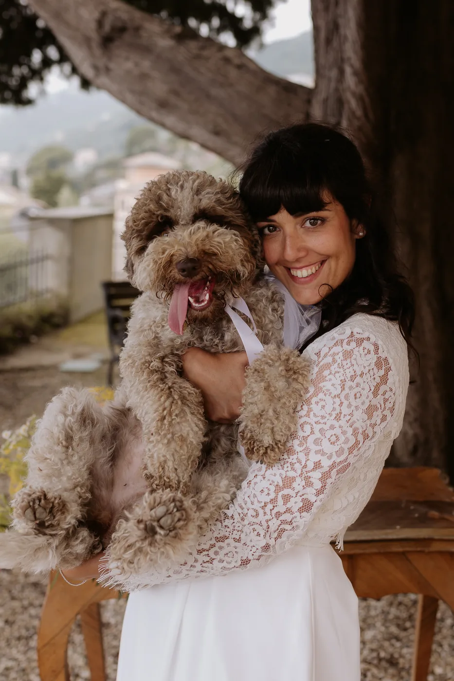 Francesca Alberico as a bride, holding her dog on her own wedding day