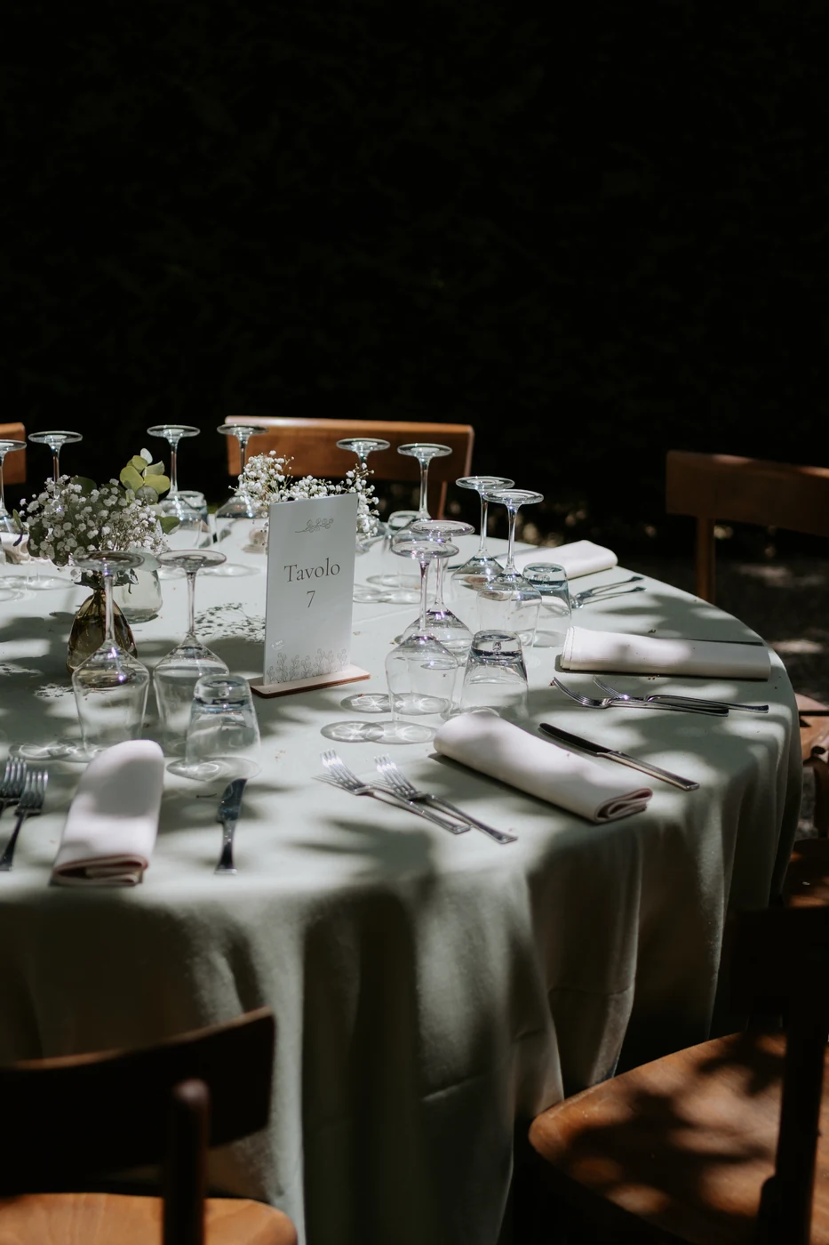 Table set with a sage green tablecloth at Villa Delfini, wedding in Piedmont
