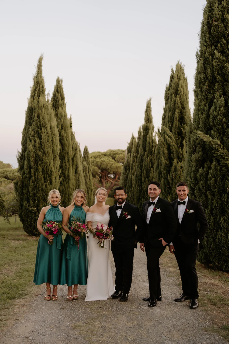 The couple with their witnesses and friends among the cypress trees at the Orangerie of Villa Lagorio