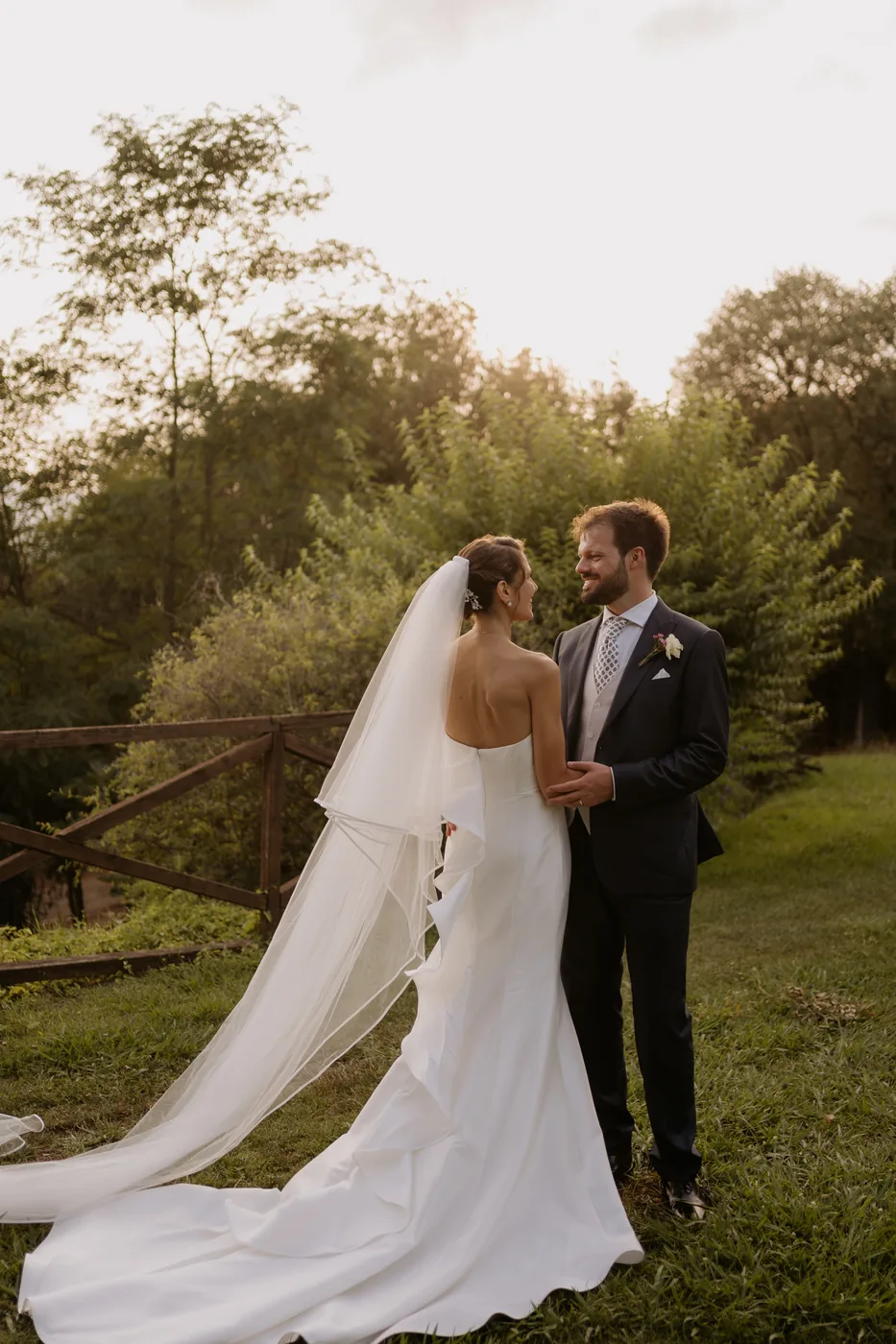 The couple looking at each other in the garden at La Ginestra at sunset